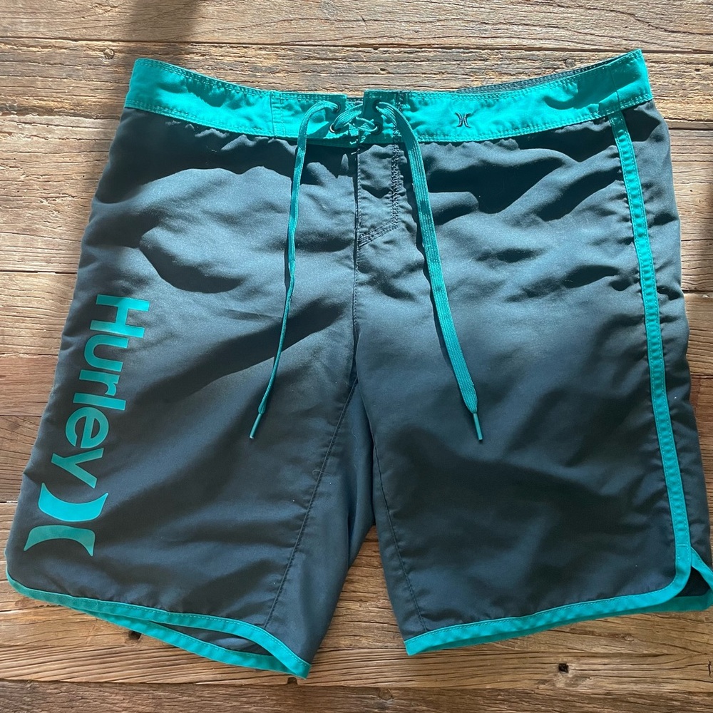 Women’s Hurley board shorts size 3. Dark blue and teal.